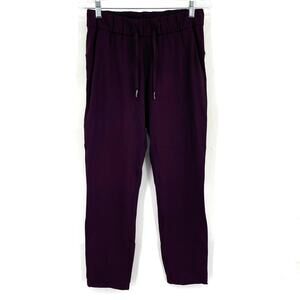 Lululemon On The Fly Woven 28" Size 6 in Dark Cherry